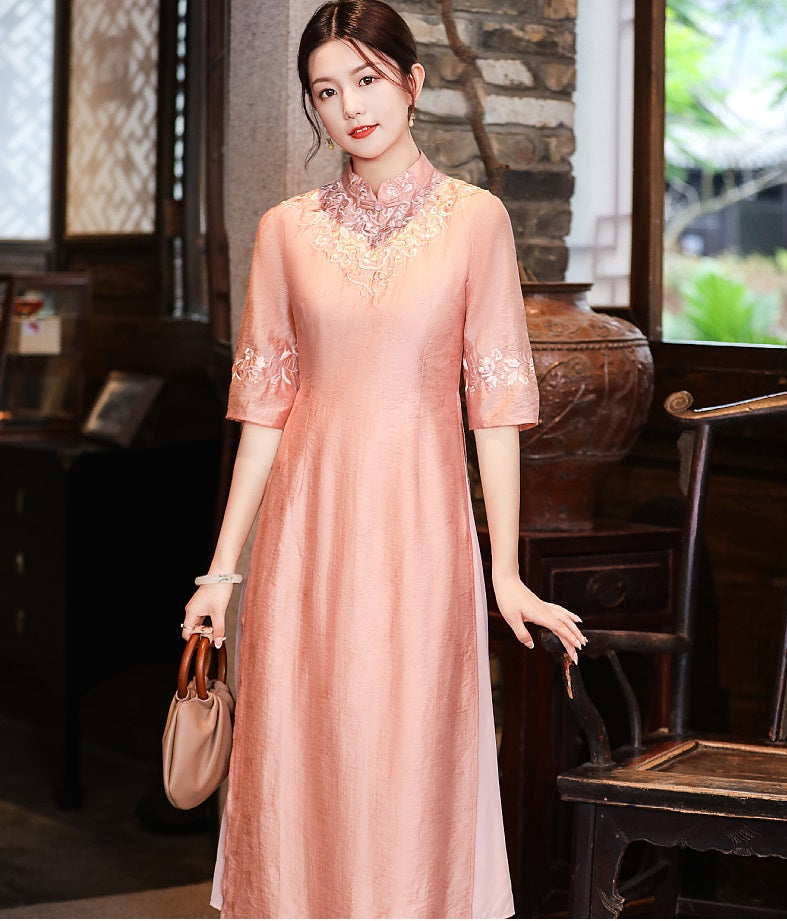 Model in loose pink  floral qipao cheongsam dress looking straight