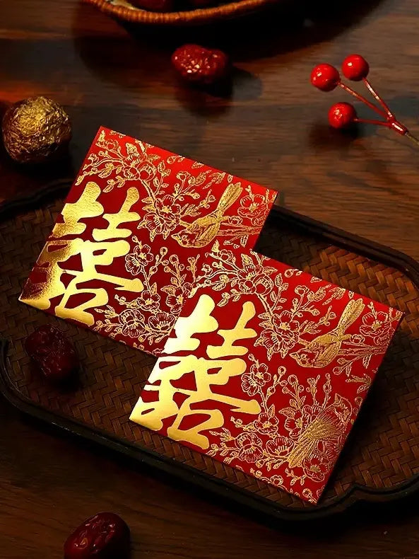 double happiness wedding Red envelopes ang pao with gold text on a wooden surface