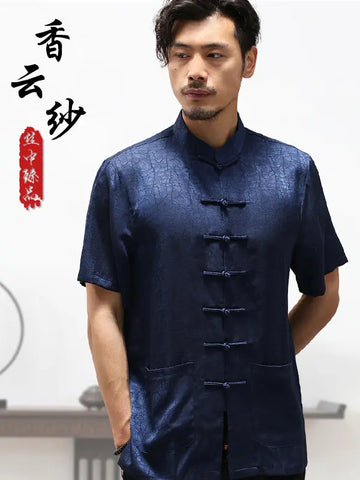 Man wearing a dark blue traditional Chinese Men's Luxury Mulberry Silk Jacquard Short Sleeve Tang Shirt garment with text on a white background
