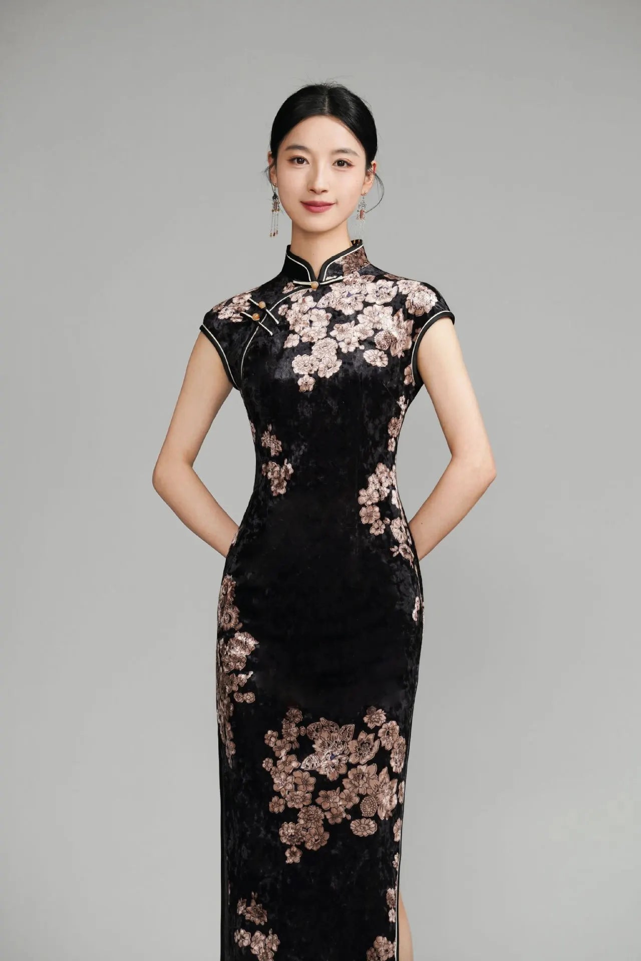 Woman wearing a Black Floral Velvet Long Qipao Cheongsam Dress against a gray background