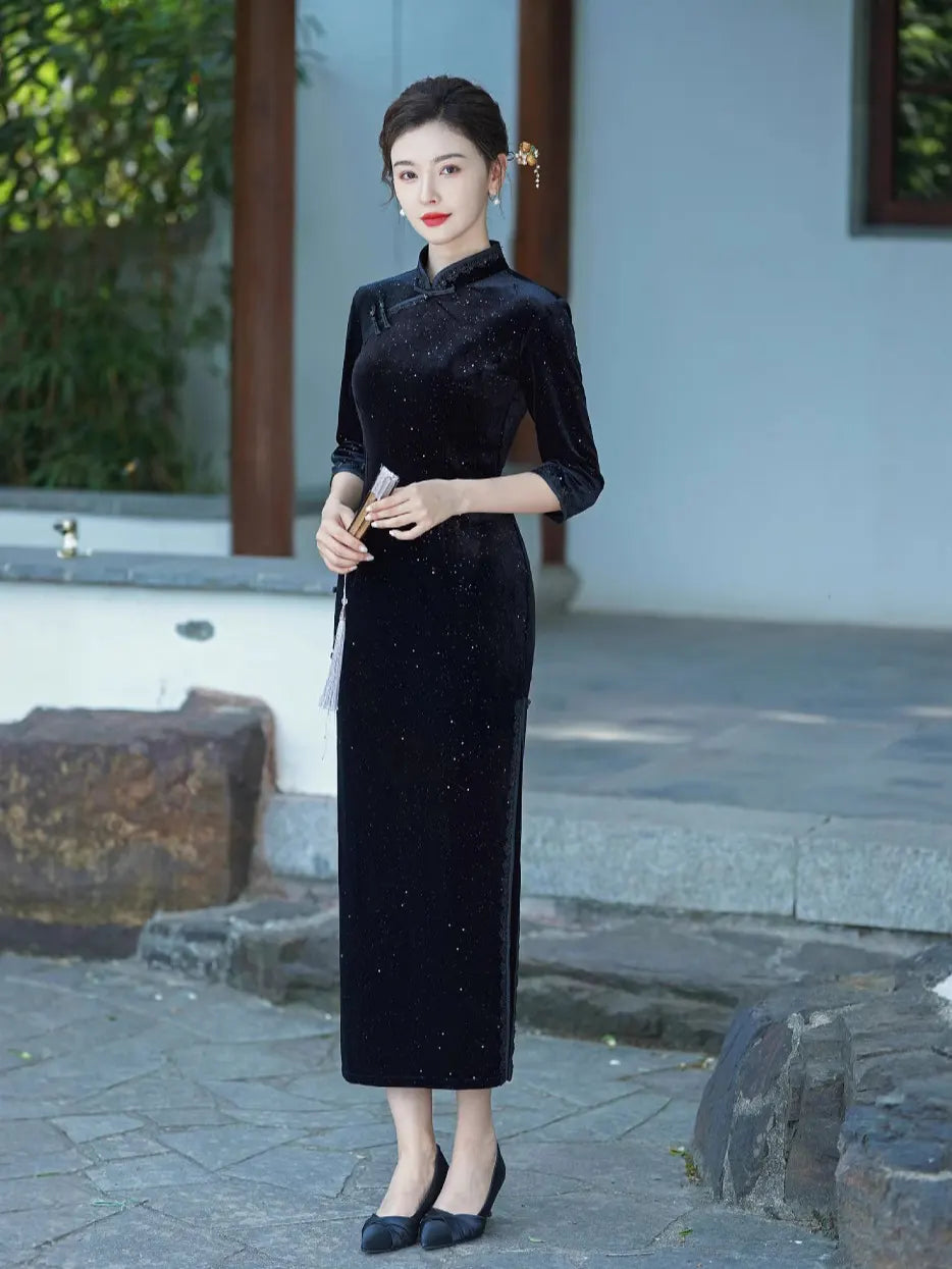 Woman in a Black Long Sleeves Velvet Chinese Qipao  Cheongsam evening Dress  dress standing outdoors with a blurred background