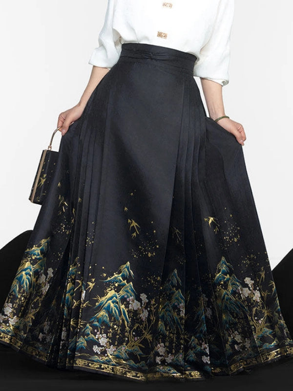 A high-waisted black pleated Chinese ming dynasty mamian horse face skirt with a gold and blue landscape print along the hem, styled with a white blouse and a small black handbag.