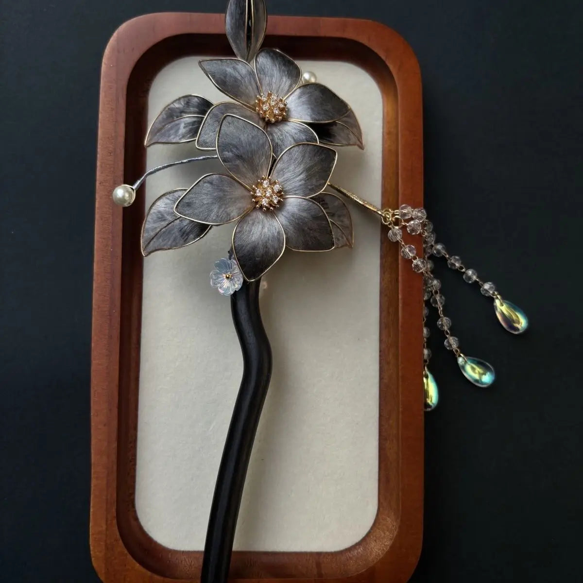 Black Sandalwood Ronghua Velvet Flower Hair Stick with Tassel  and beads on a dark background