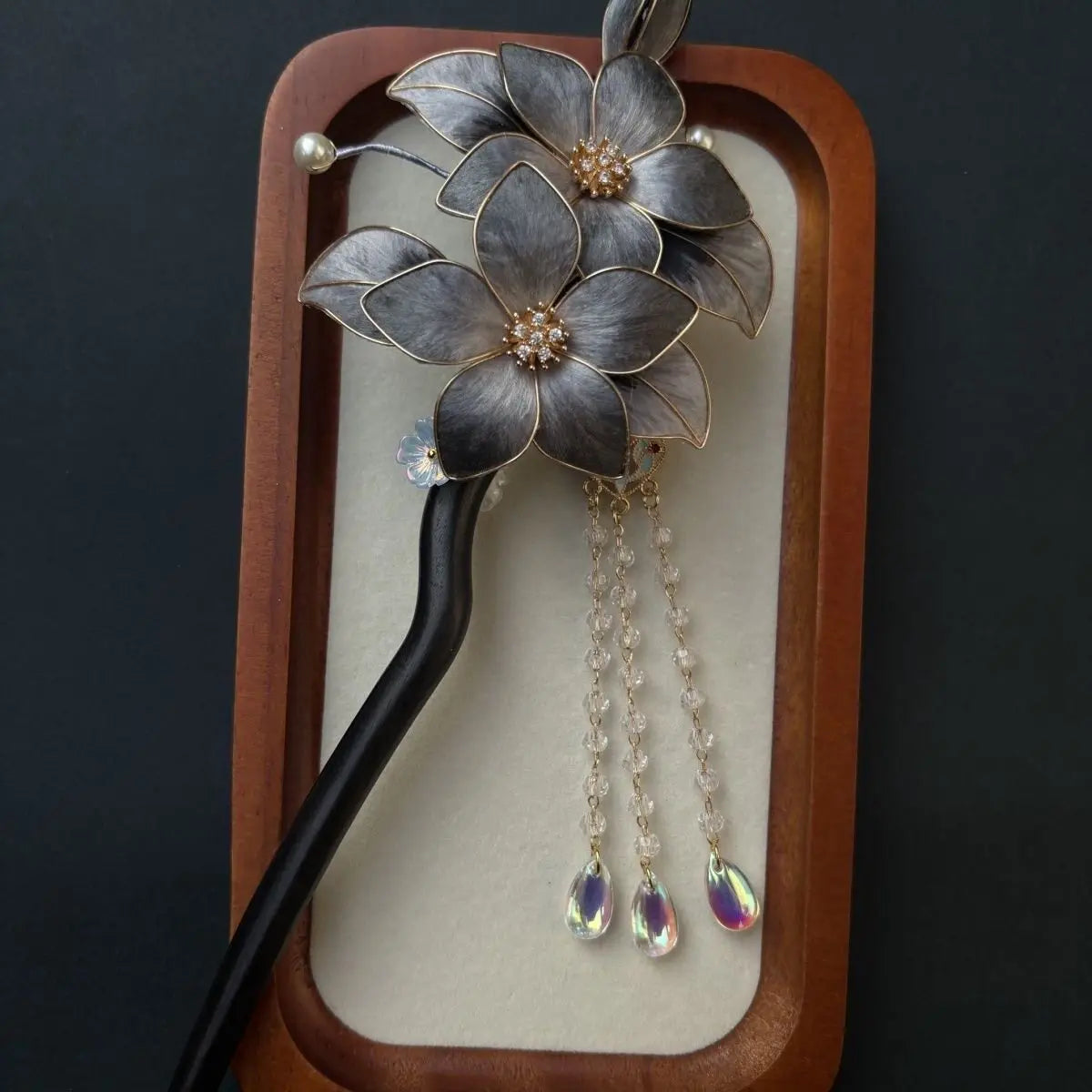 Black Sandalwood Ronghua Velvet Flower Hair Stick with Tassel and dangling elements on a dark background
