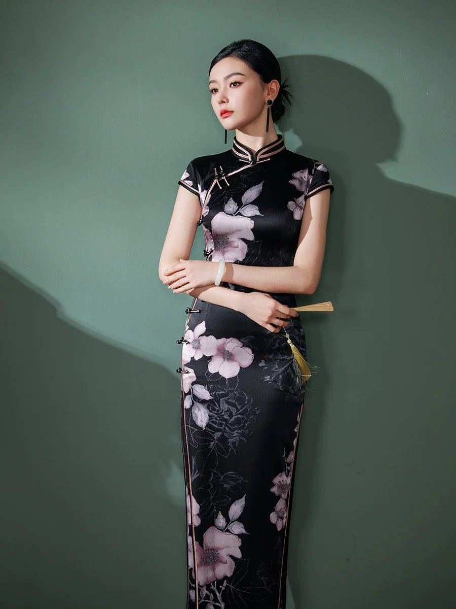 Woman wearing a Black Silk Chinese Qipao Dress – Elegant Mandarin Collar Cheongsam against a green background