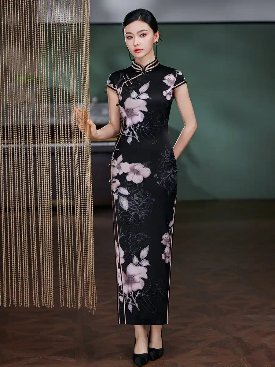Woman in aBlack Silk Chinese Qipao Dress – Elegant Mandarin Collar Cheongsam standing next to a decorative curtain.