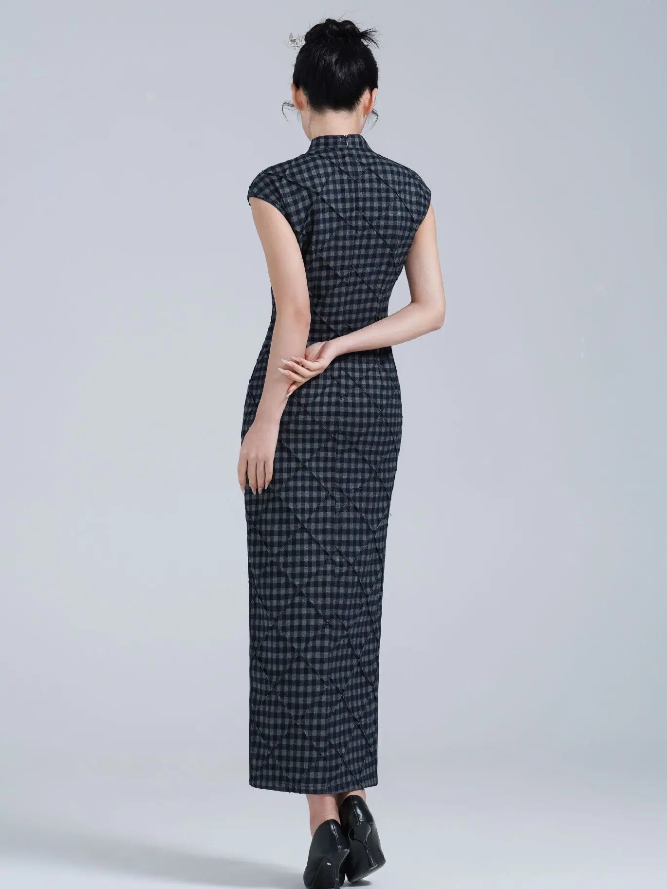 Woman wearing a Black Vintage Plaid Modern Cap Sleeve Qipao Dress  on a plain background