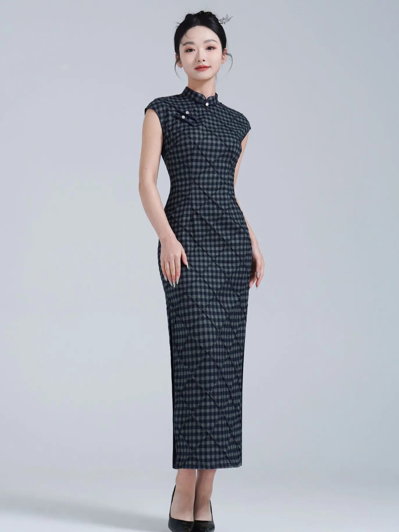 Woman wearing a Black Vintage Plaid Modern Cap Sleeve Qipao Dress  dress on a gray background