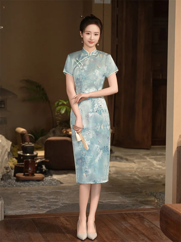 Woman wearing a light Blue Floral Cheongsam Qipao Dress in an indoor setting