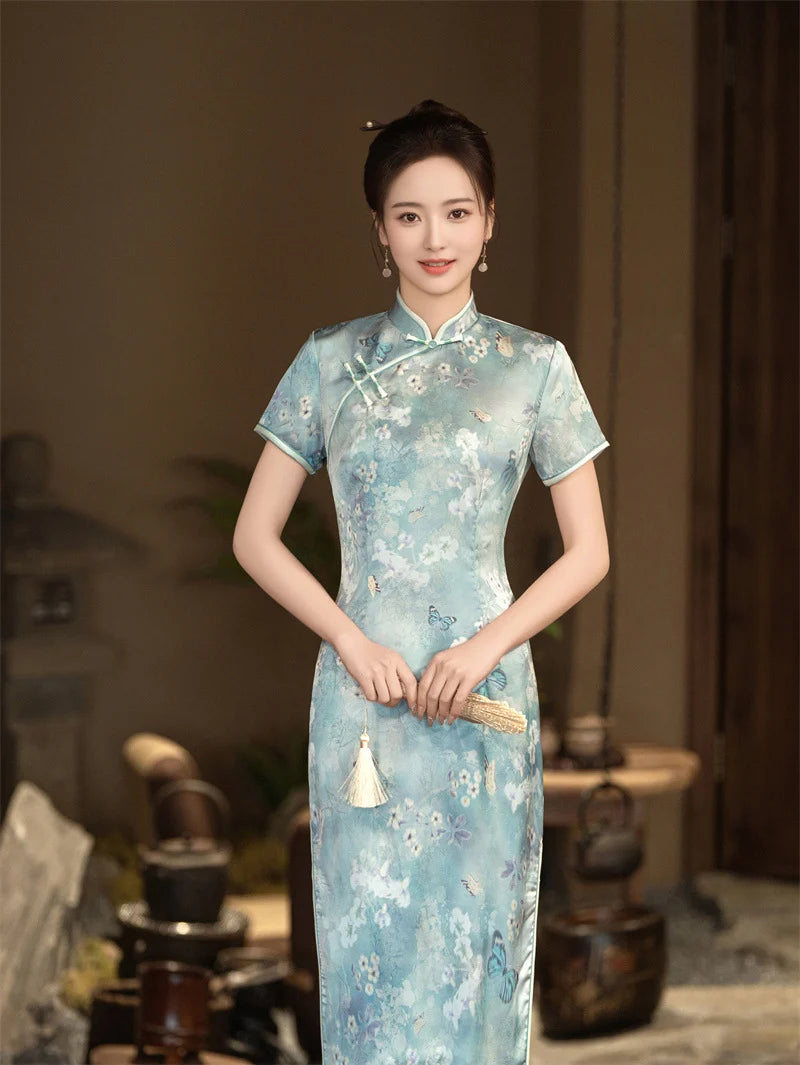 Woman wearing a Blue Floral Cheongsam Qipao Dress in an indoor setting