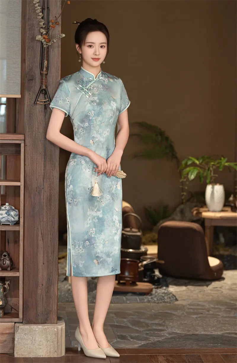 Woman wearing a light Blue Floral Cheongsam Qipao Dress  in an indoor setting