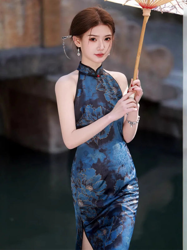 Woman in a Blue Floral Halter Qipao Cheongsam Dress  holding an umbrella with a blurred background