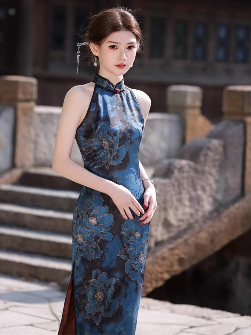 Woman in a Blue Floral Halter Chinese modern Qipao Cheongsam Dress  standing outdoors with stone steps and walls in the background