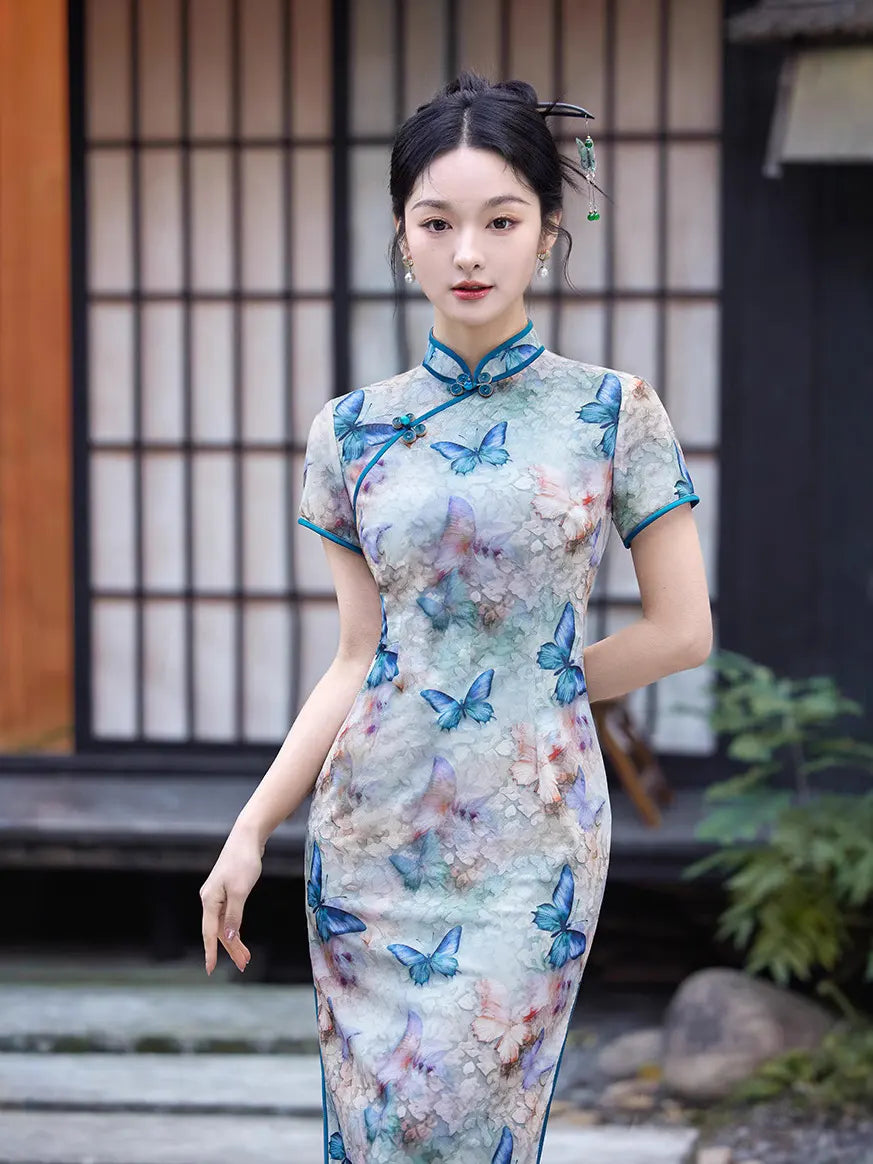 Woman wearing a traditional Blue Midi Length Qipao Dress with Butterfly and Floral Print  in an outdoor setting.