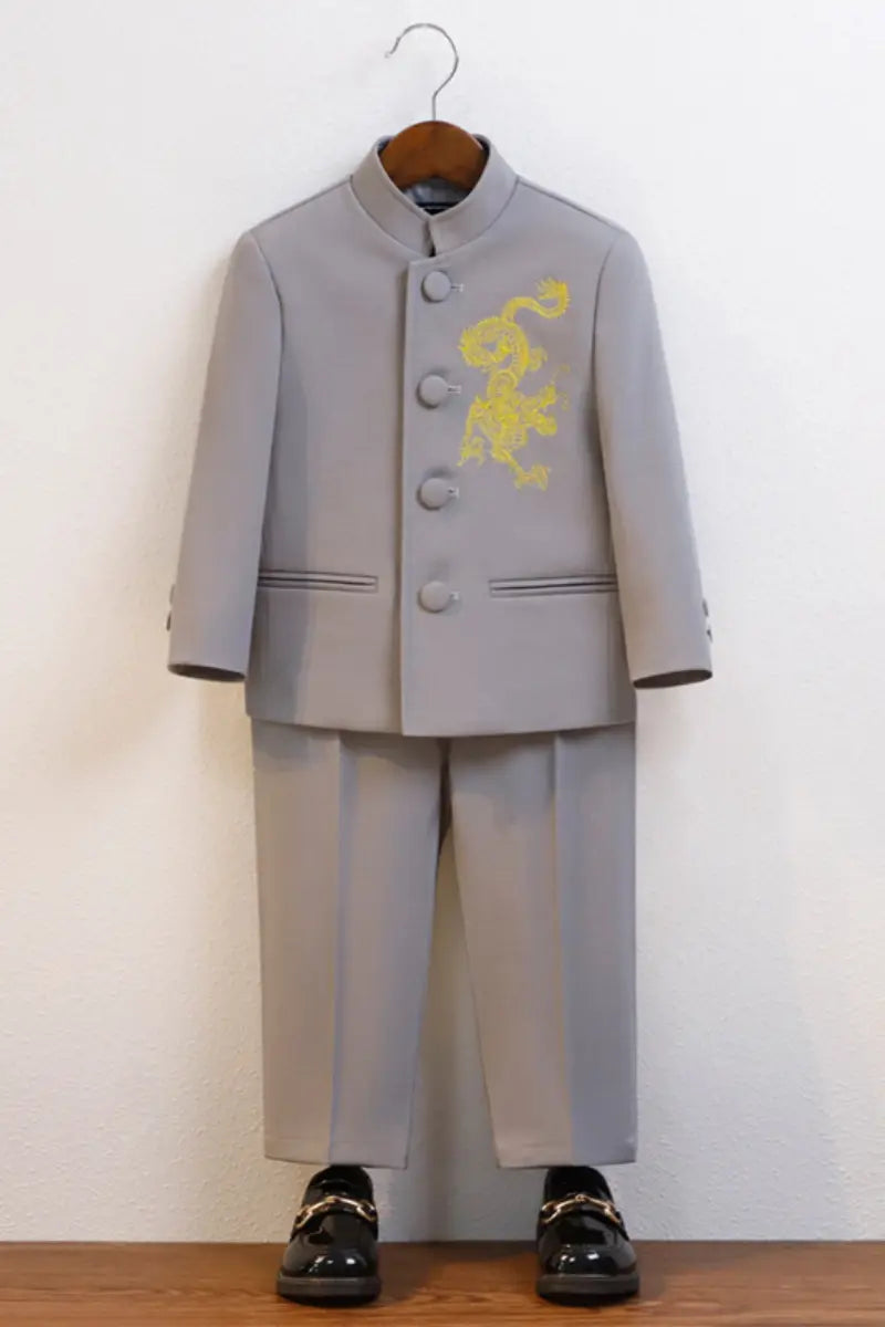 Gray Boys' New Chinese Style Dragon Embroidered Zhongshan Suit Set  on a wooden hanger against a white wall.