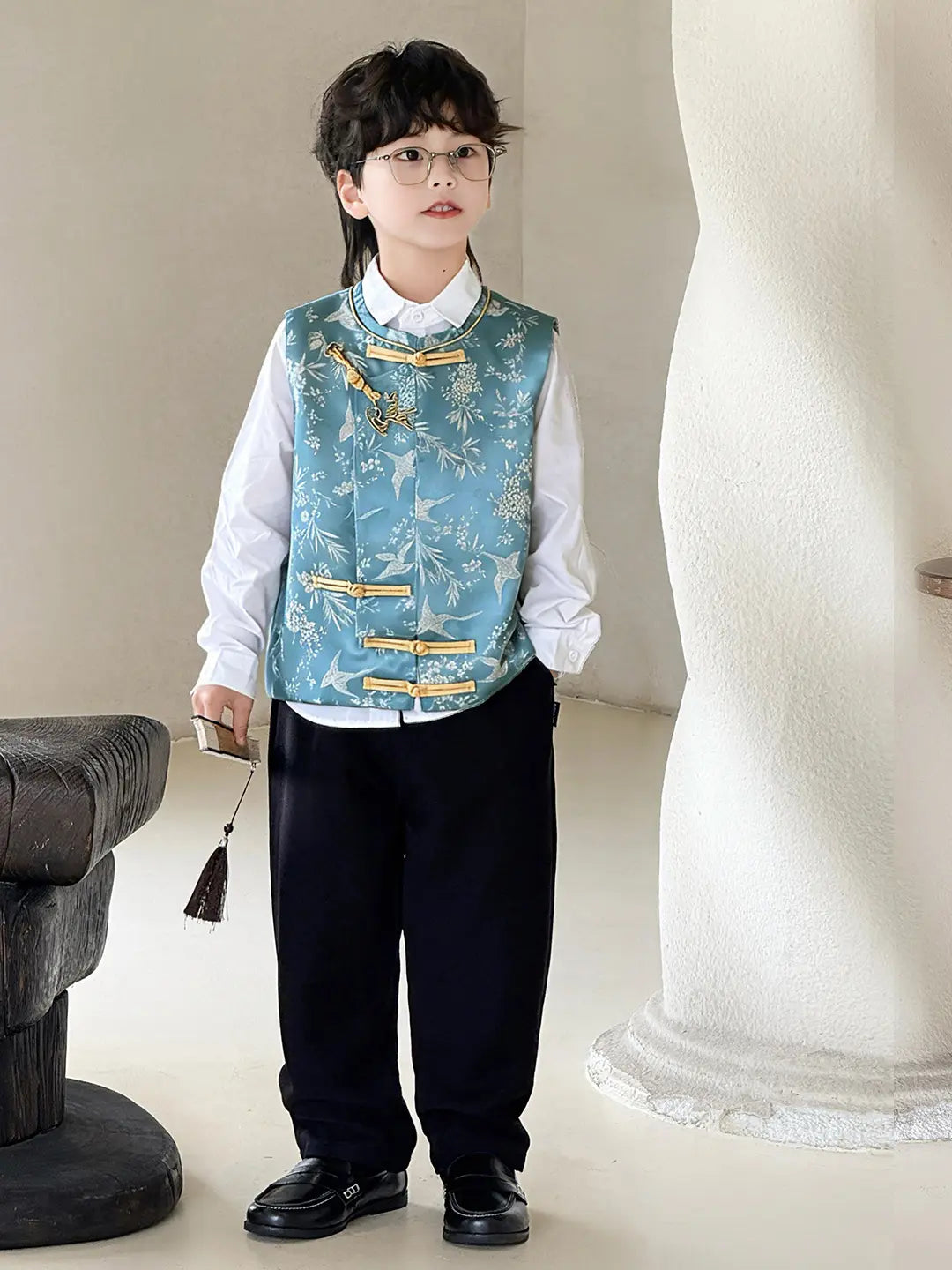 Child wearing a formal Boys' Traditional Chinese Style Blue Vest  in an indoor setting