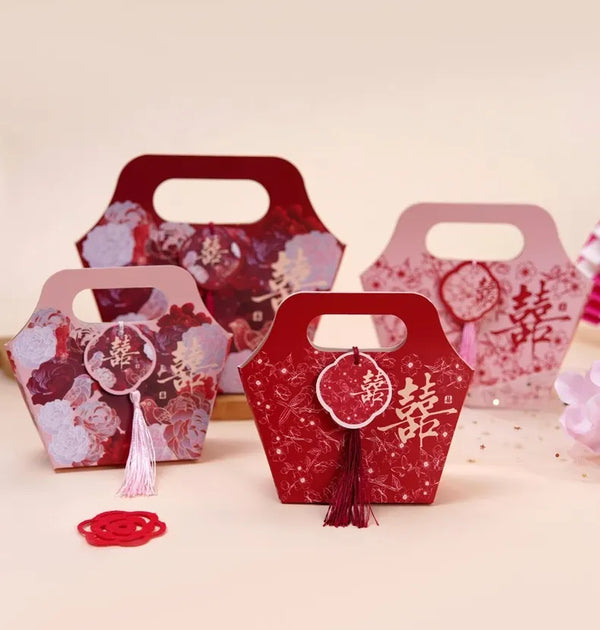 Floral Chinese Wedding Favor Boxes with Double Happiness Tassel and Chinese characters on a light background