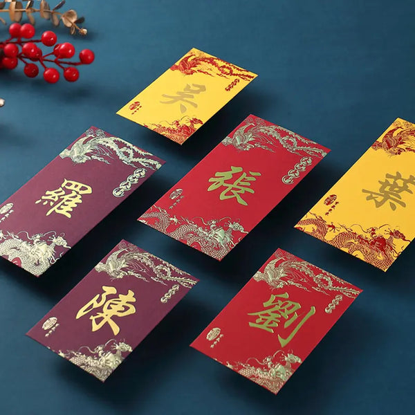 Six Chinese New Year red envelopes with gold characters and dragon phoenix designs are arranged on a dark blue background with decorative red berries in the top left corner.