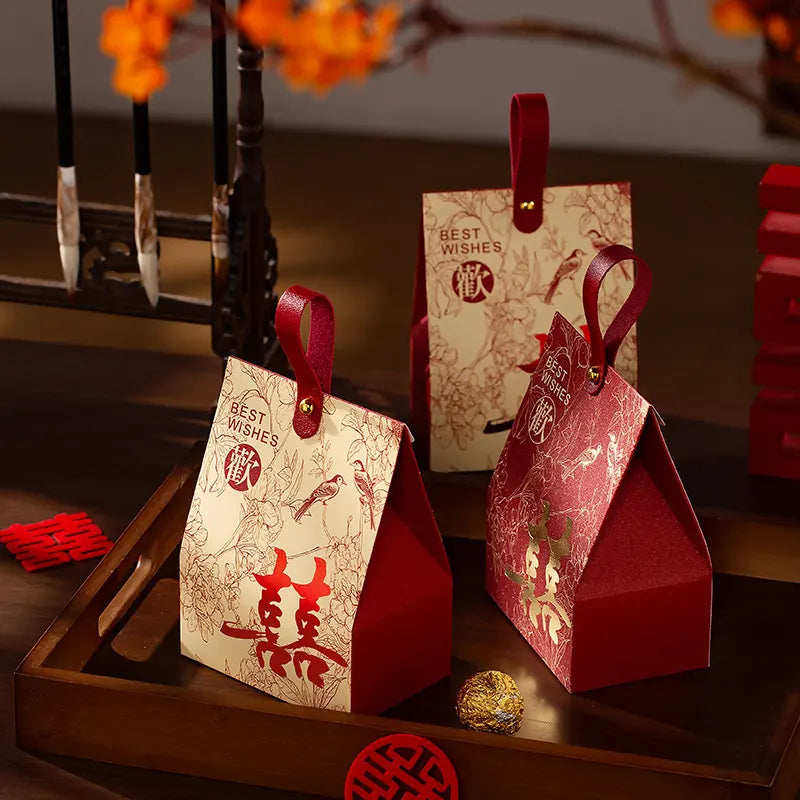  Double Happiness Chinese Wedding Favor BOX with red handle on a wooden surface.