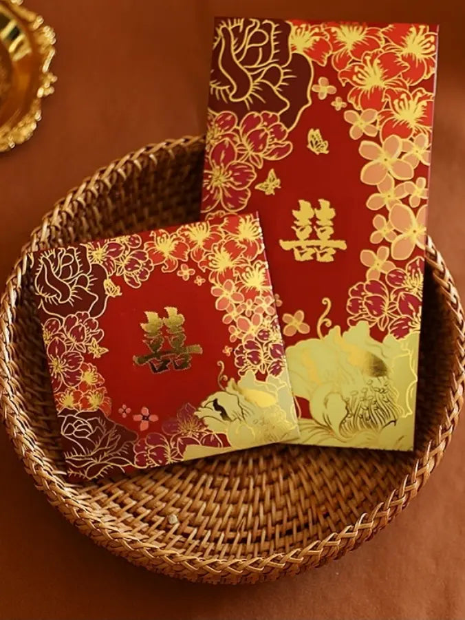 Double Happiness  Floral Wedding Red Envelopes with gold designs on a woven basket against a brown background