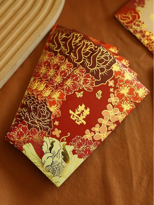 Double Happiness  Floral Wedding Red Envelopes  with gold floral patterns on a brown surface