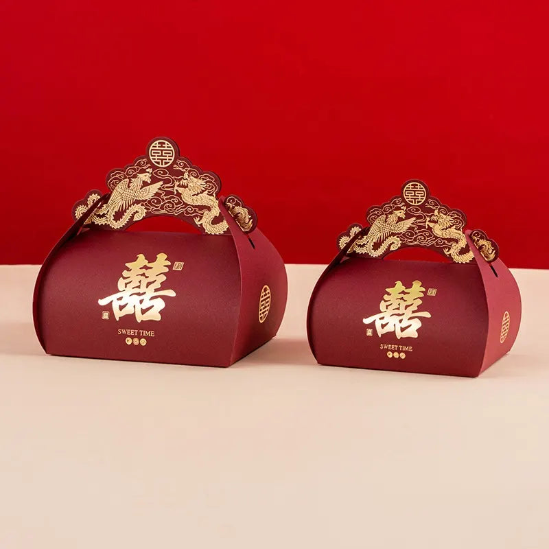 Two red Dragon & Phoenix Double Happiness Chinese Wedding Favor Boxes  with gold accents on a red background