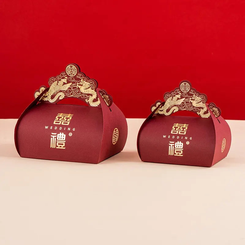 Two red Dragon & Phoenix Double Happiness Chinese Wedding Favor  gift boxes with gold accents on a red background