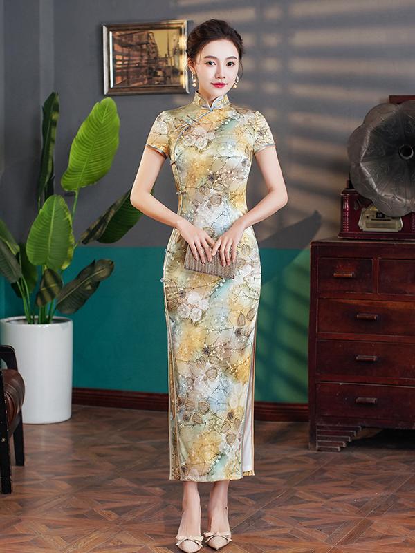 Woman in a Elegant Floral Mulberry Silk Qipao Cheongsam Dress  standing in a room with a plant and wooden furniture.