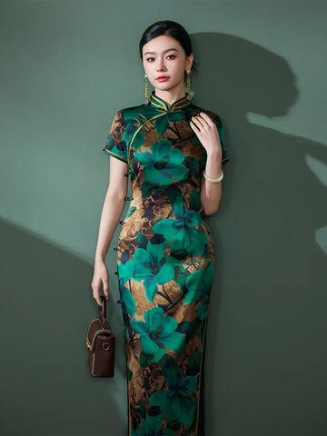 Woman wearing a Emerald Green Floral Silk Chinese Qipao Cheongsam Dress  against a green background