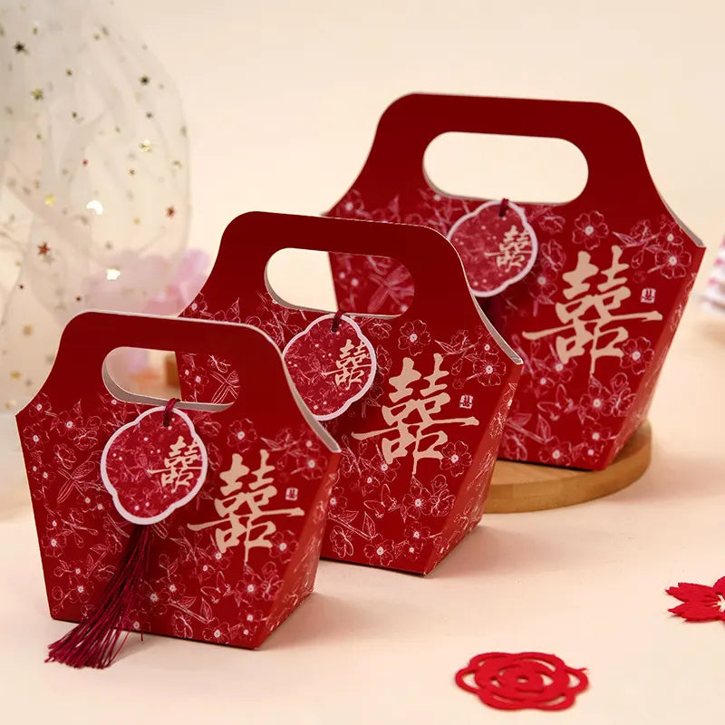 Red Floral Chinese Wedding Favor Boxes with Double Happiness Tassel  with Chinese characters on a light background