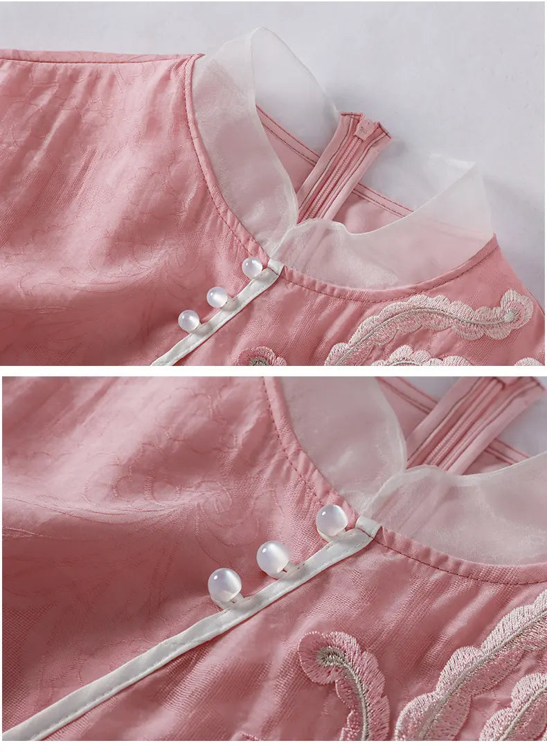 Close-up of a pink garment with lace and button details on a white background