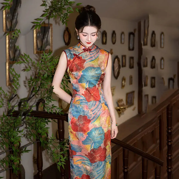 Woman in a colorful Floral Sleeveless Traditional Chinese Qipao Cheongsam Dress standing in an elegant interior setting.