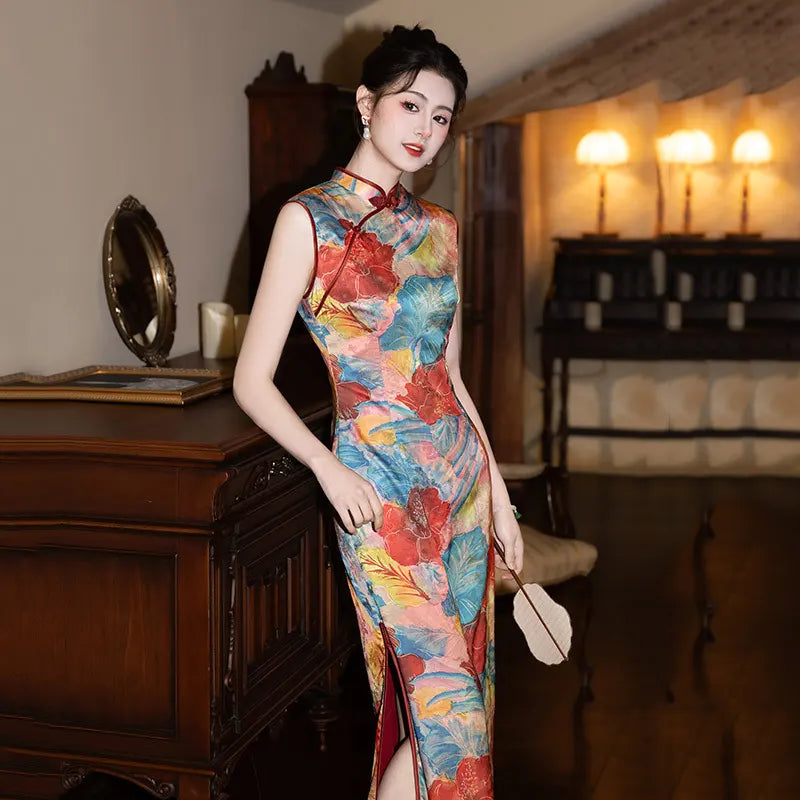 Woman in a colorful Floral Sleeveless Traditional Chinese Qipao Cheongsam Dress  standing in a room with wooden furniture and decorative items.
