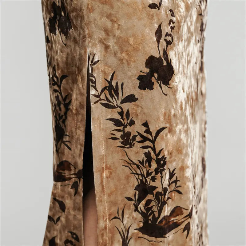 Close-up of a fabric with black floral patterns on a beige background