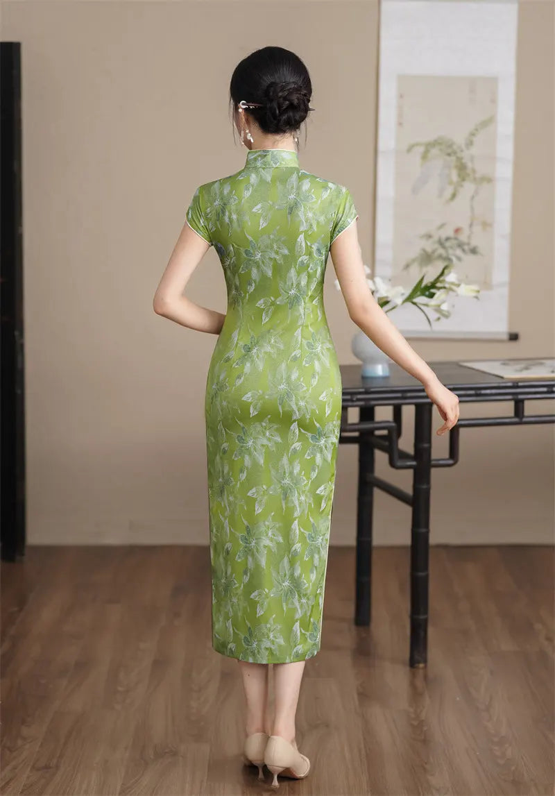 Woman wearing a Green Floral  Cap Sleeve Modern Qipao Cheongsam Dress  in an indoor setting