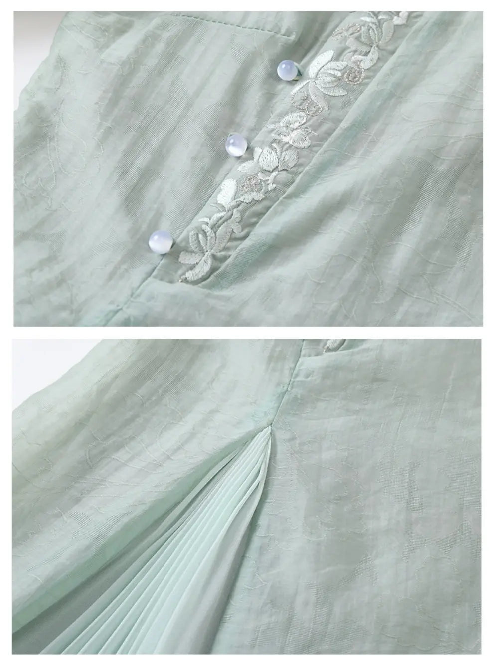 Close-up of a pale mint green garment showing embroidered floral trim with pearl-like buttons and a pleated fabric detail.