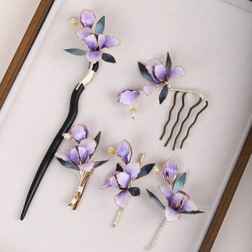 Set of floral hairpins and a comb on a light background