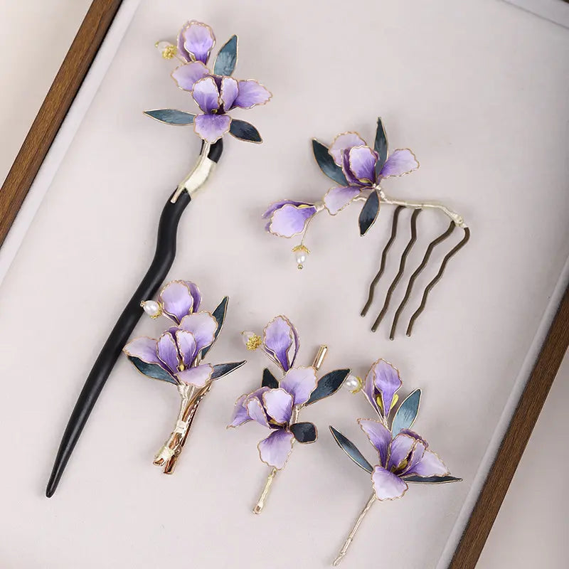 Set of floral hairpins and a comb on a light background
