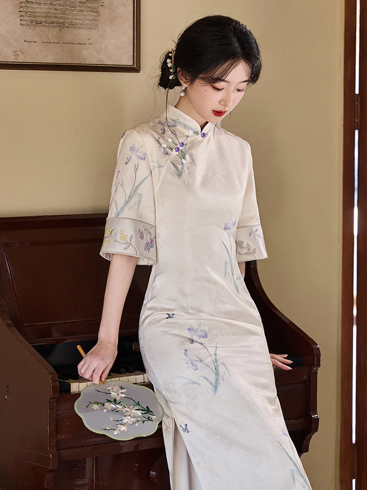 Woman in a traditional Chinese Ivory Floral Jacquard Qipao Dress with Embroidery dress standing next to a piano in a room with a painting on the wall.
