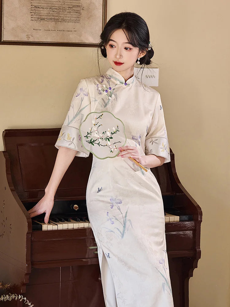 Woman in a traditional Chinese Ivory Floral Jacquard Qipao cheongsam Dress with Embroidery  standing next to a piano.