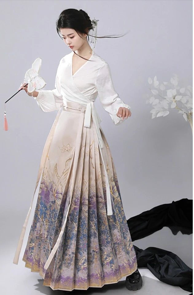 Woman wearing a traditional Jacquard Brocade Gold Woven Floral Hanfu Mamian Skirt outfit with a white top and floral skirt on a gray background
