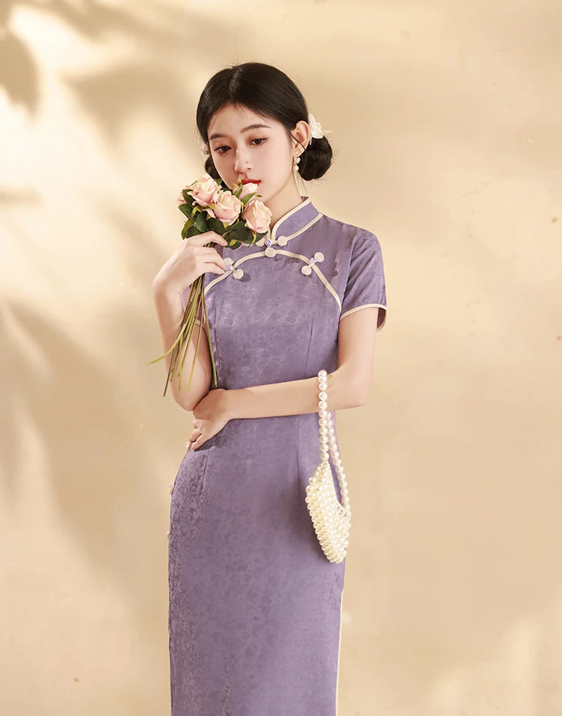 Woman in a purple Lavender Floral Short Sleeves Jacquard Qipao Dress holding flowers against a beige background
