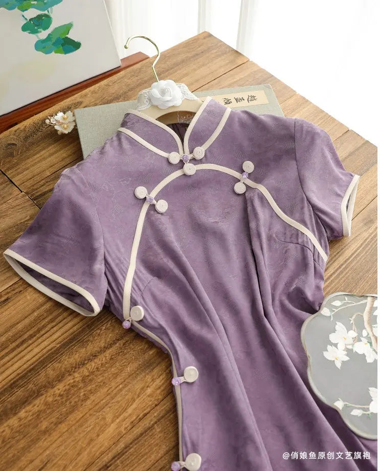 Purple traditional  Lavender Floral Short Sleeves Jacquard Qipao outfit with white buttons on a wooden surface