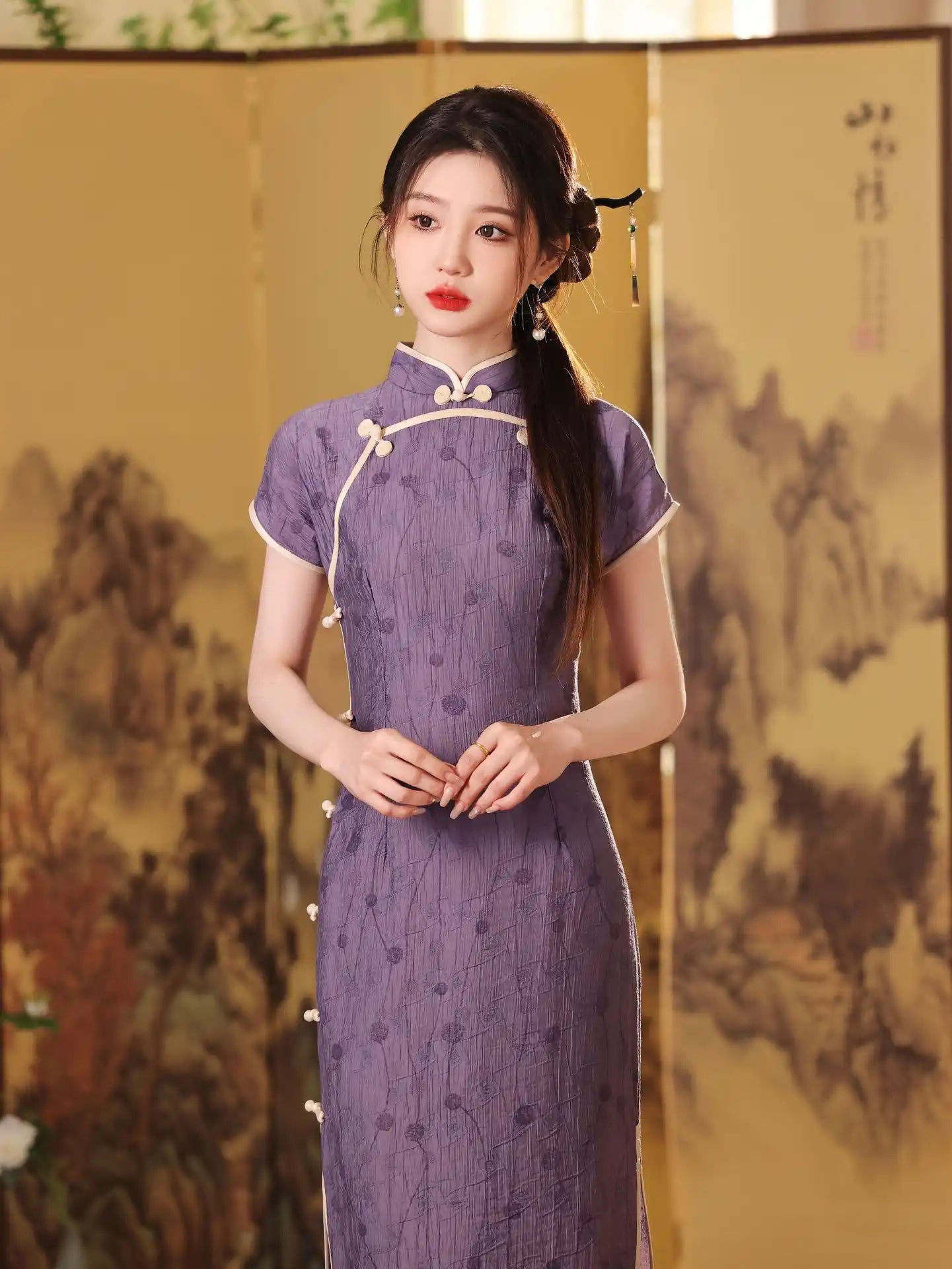 Woman in a purple Lavender Floral Short Sleeves Jacquard  traditional cheongsam Qipao dress standing in front of a decorative screen.