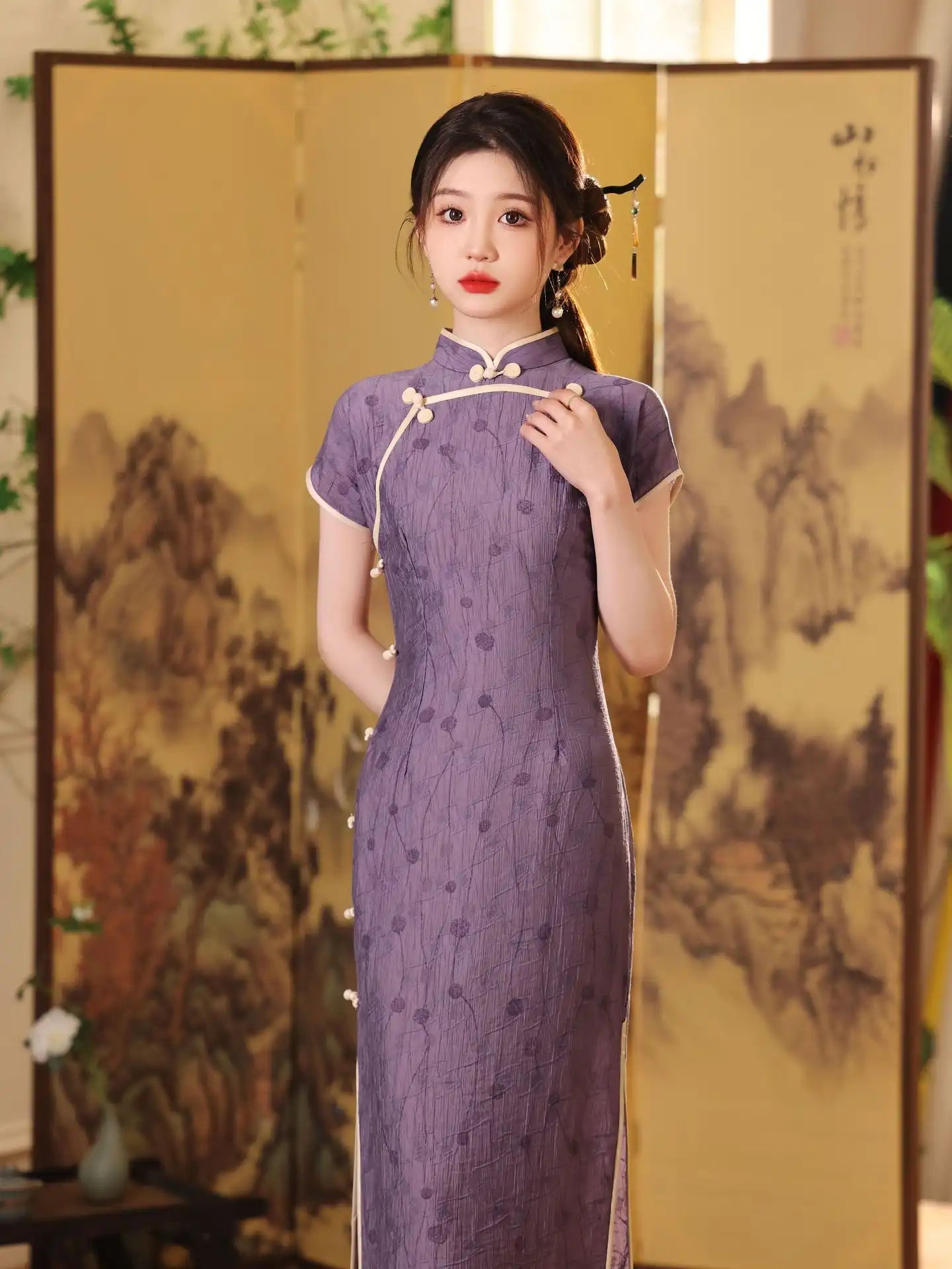 Woman in a purple traditional Lavender Floral Short Sleeves Jacquard Qipao Dress standing in front of an artistic screen.