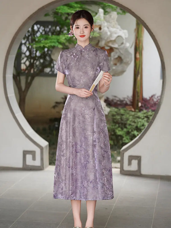 A woman stands in front of a circular architectural opening in a garden, wearin g a lavender-purple short-sleeve Floral Jacquard Modern A Line Qipao cheongsam dress with a subtle floral pattern. She holds a folding fan.