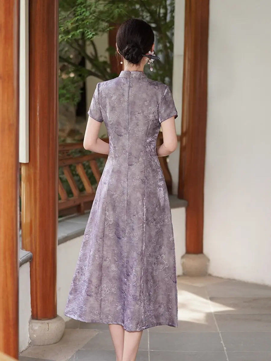 A woman viewed from behind wearing a short-sleeved Lilac Purple Floral Jacquard Modern A Line Qipao cheongsam-style dress with a subtle tonal floral pattern, standing in a traditional courtyard with wooden pillars.