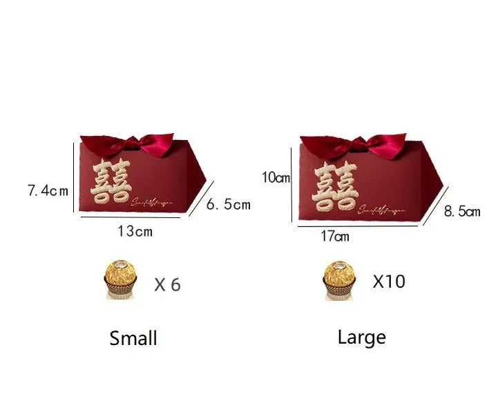 Red gift boxes with gold text and measurements, accompanied by small and large chocolate bars.