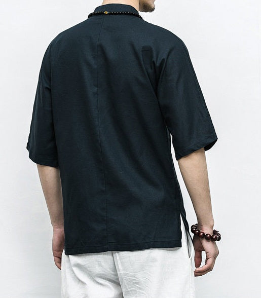 Person wearing a black Men’s Linen Cotton Chinese Mandarin Collar Shirt  with a white background