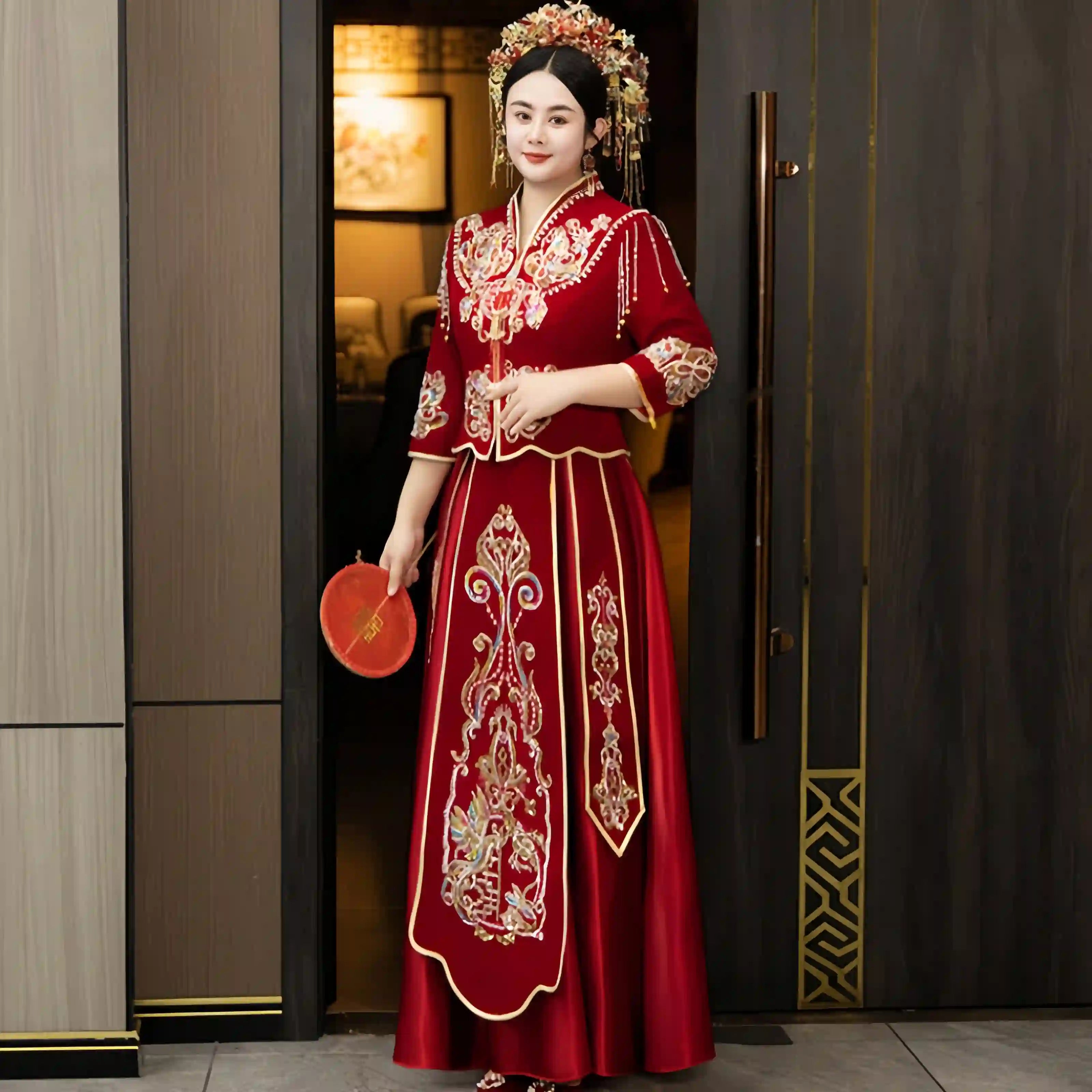 Woman in a  Modern Red Qun Kwa / Xiuhe Chinese Wedding Gown  standing in a doorway.